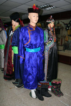 Manaquines wearing Mongolian clothes with different variety of boots