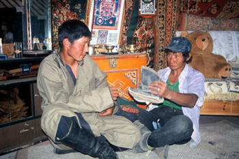 Photo of men holding picture of child's Mongolian Boots
